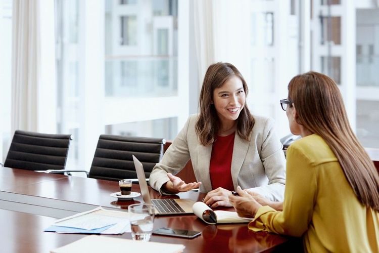 A woman meeting with a financial planner